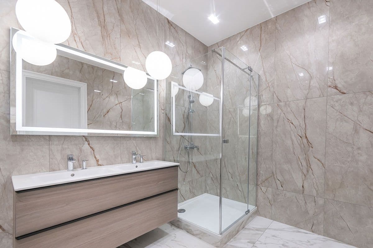 TBS installs space saving corner showers image