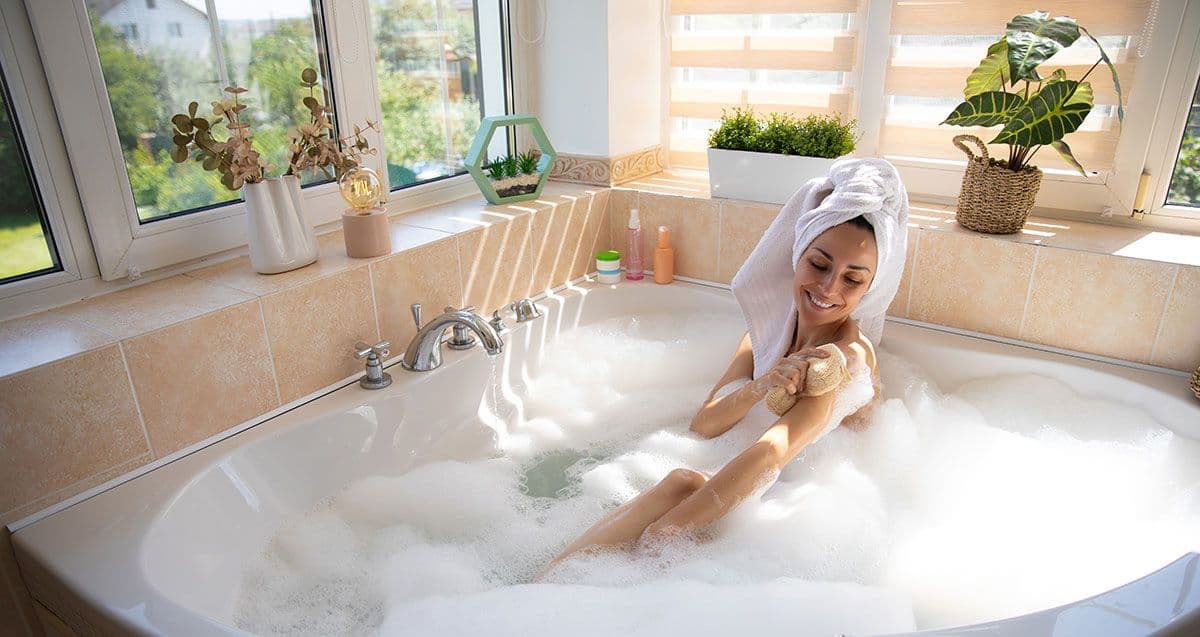 Woman enjoying a spa bath