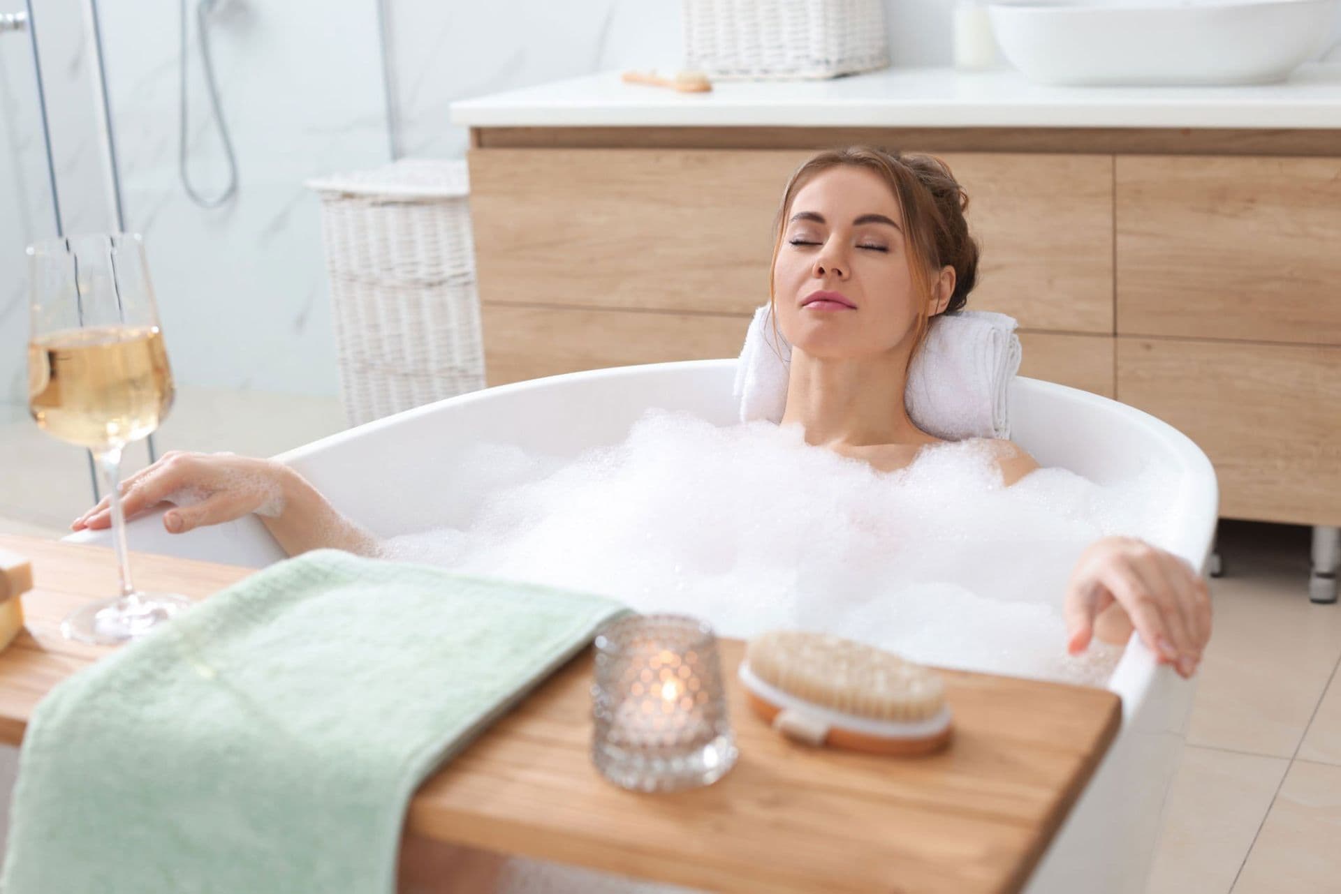 Woman soaking in tub