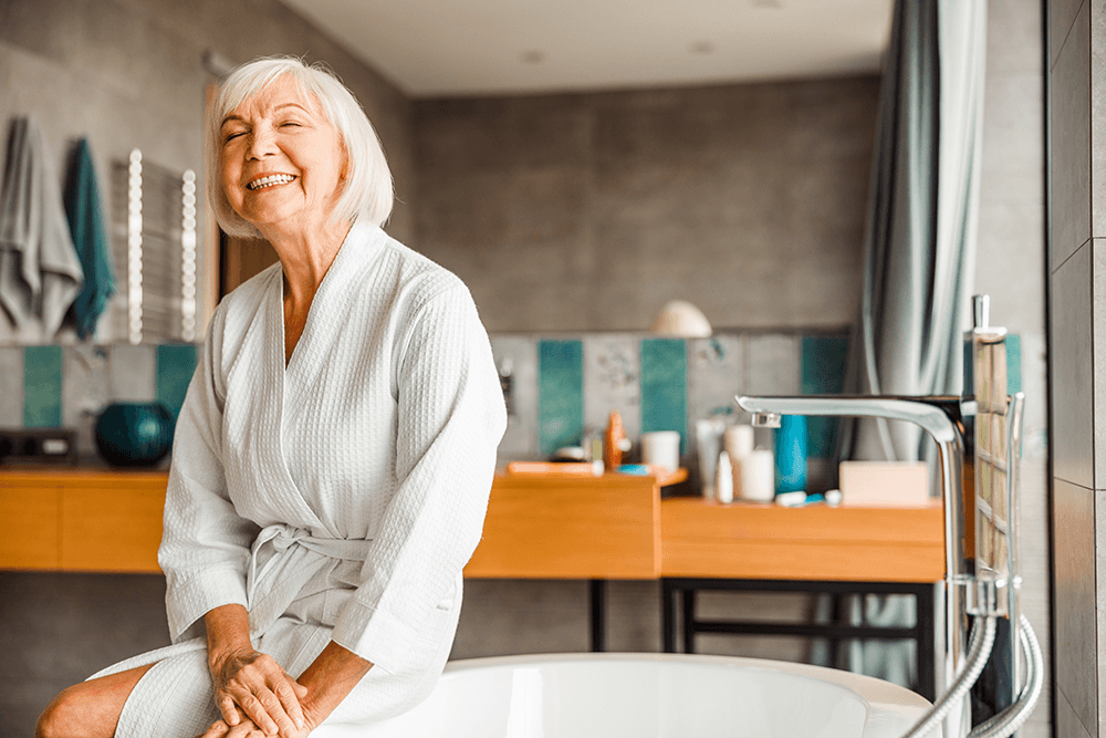 Elderly Woman enjoying her bathroom designed for aging in place